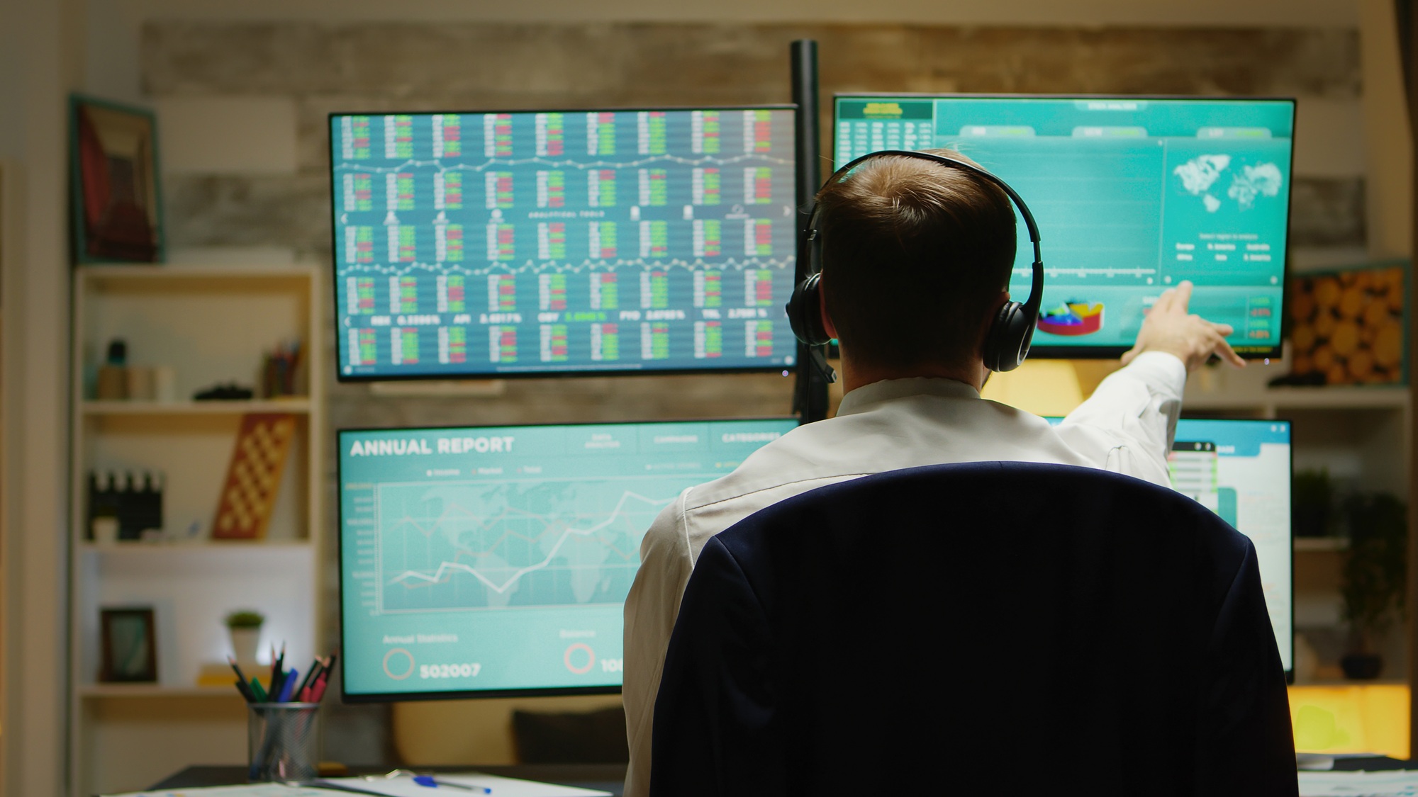 Excited stock market trader with hands up